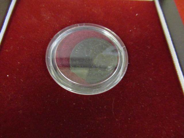 CASED ANCIENT COIN Image