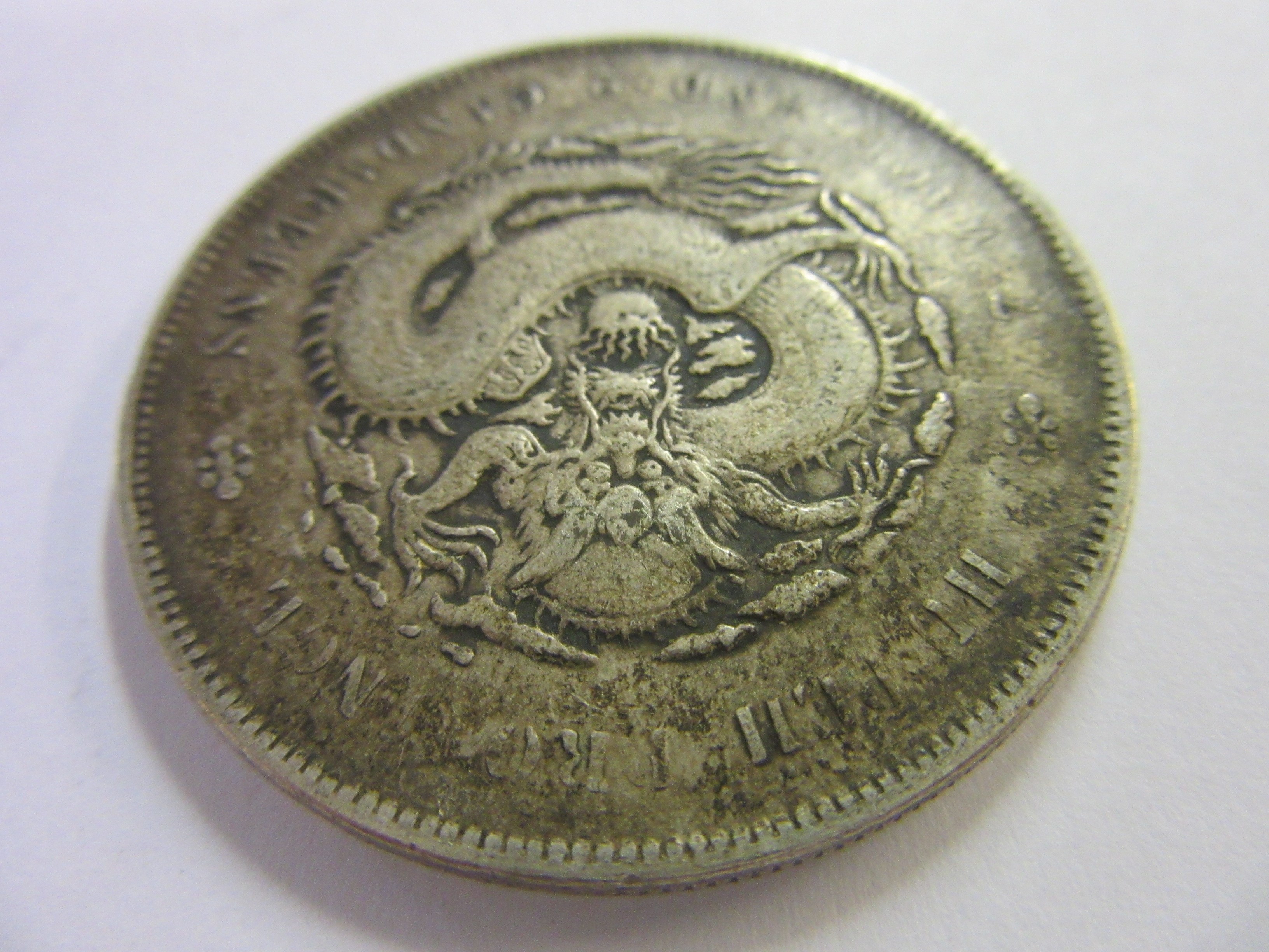 FOUR SILVER CHINESE COINS Image