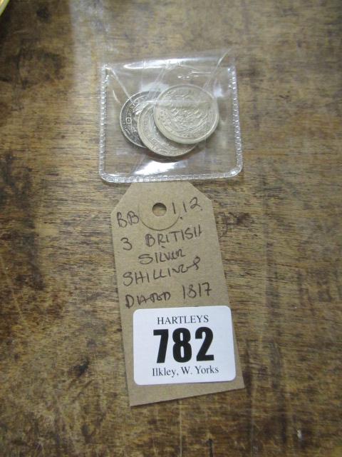 THREE BRITISH SILVER SHILLINGS DATED 1817 AND 1887 Image