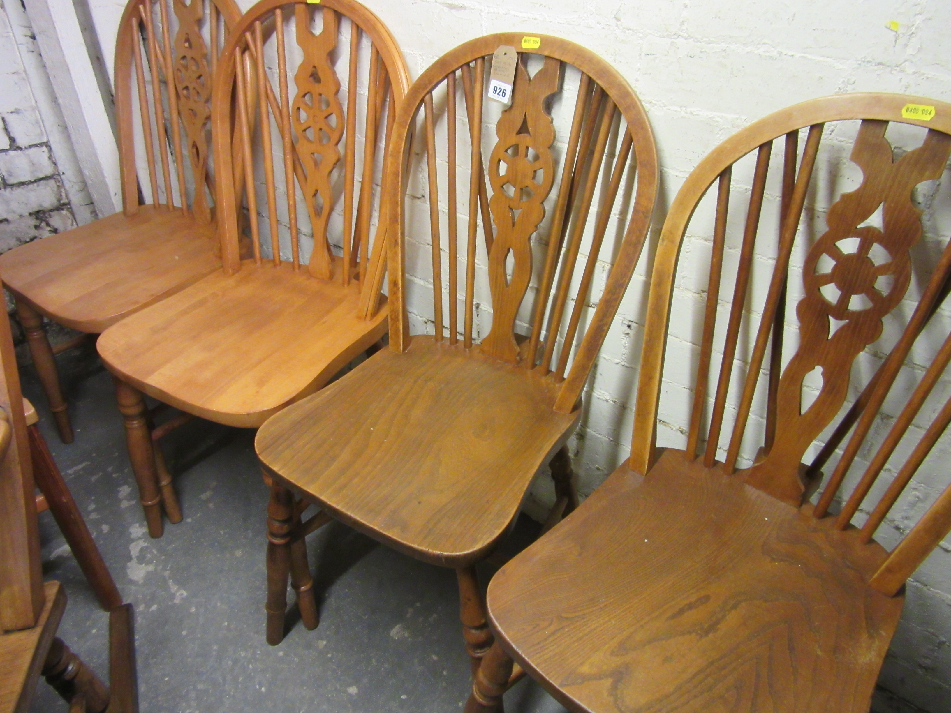 SET OF FOUR WHEEL BACK CHAIRS Image