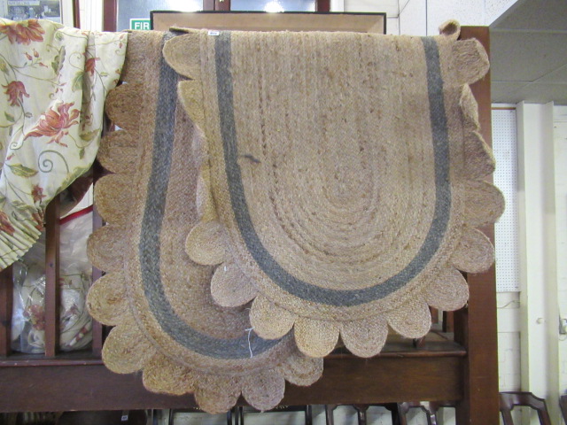 TWO MATCHING PETAL EDGED JUTE RUGS Image