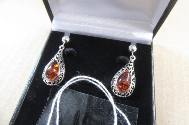 PAIR OF CELTIC SILVER AND AMBER EARRINGS Image