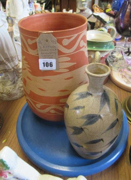 TWO POTTERY VASES ON REVOLVING WOODEN STAND Image
