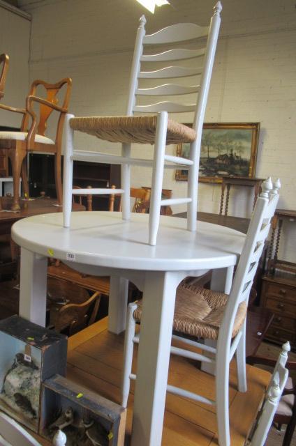 PAINTED OAK CIRCULAR DINING TABLE AND FOUR RUSH SEATED CHAIRS Image