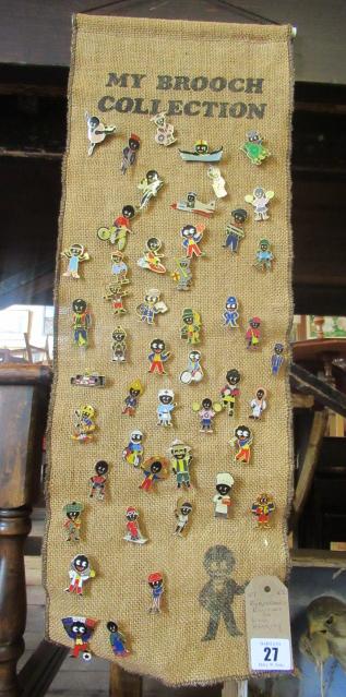 ROBERTSONS BROOCHES ON WALL HANGING Image