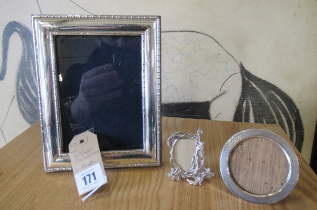 TWO SILVER PHOTO FRAMES AND ANOTHER Image