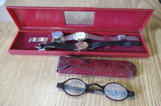 THREE LADY'S WATCHES AND A PAIR OF GLASSES Image