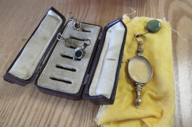 FOLDING GLASSES AND WINDING KEY Image