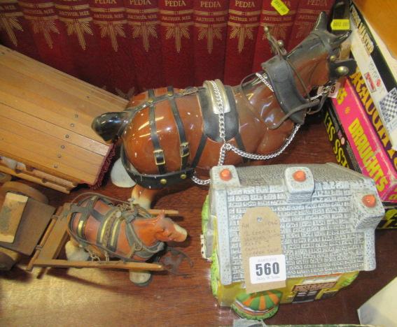 TWO CERAMIC HORSES AND CARTS AND A CERAMIC COFFEE SHOP Image