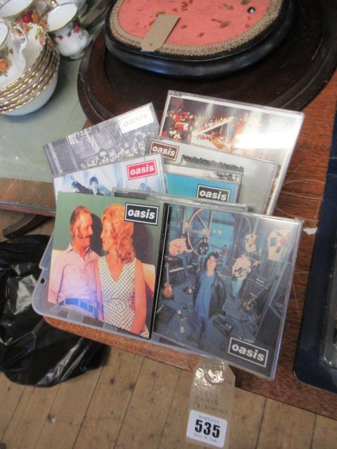 QUANTITY OF 1990S OASIS CD SINGLES Image