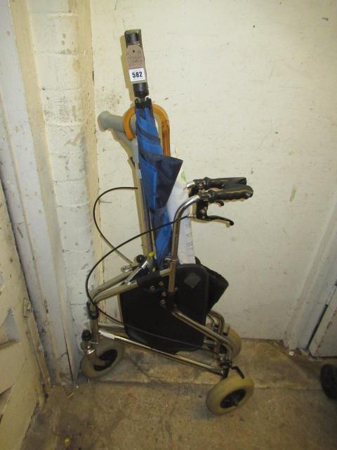 MOBILITY AID WITH WALKING STICKS AND UMBRELLAS Image