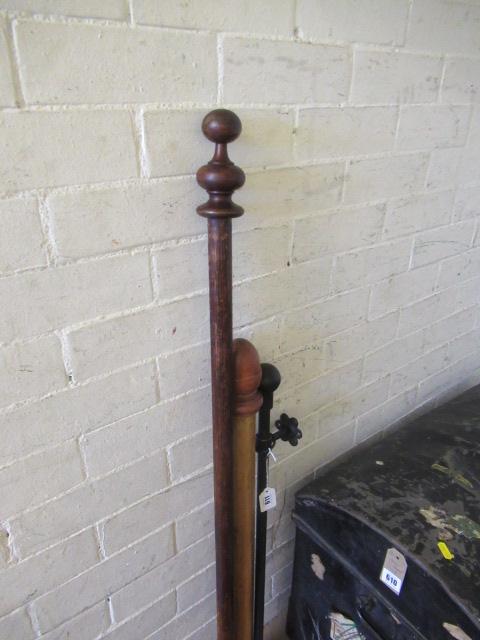 TWO WOODEN AND ONE METAL CURTAIN POLES Image