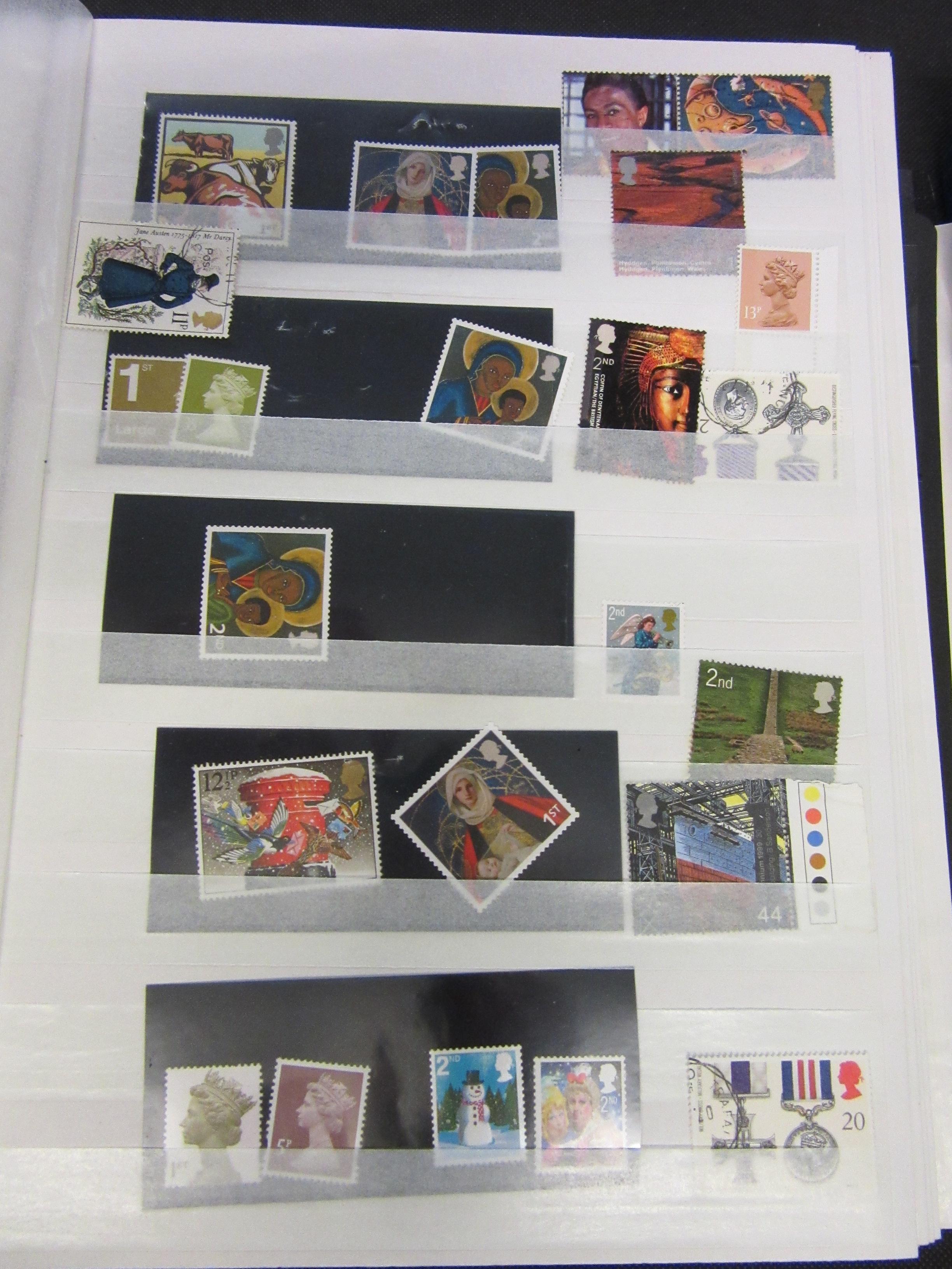 TWO ALBUMS OF MINT AND USED UK STAMPS Image