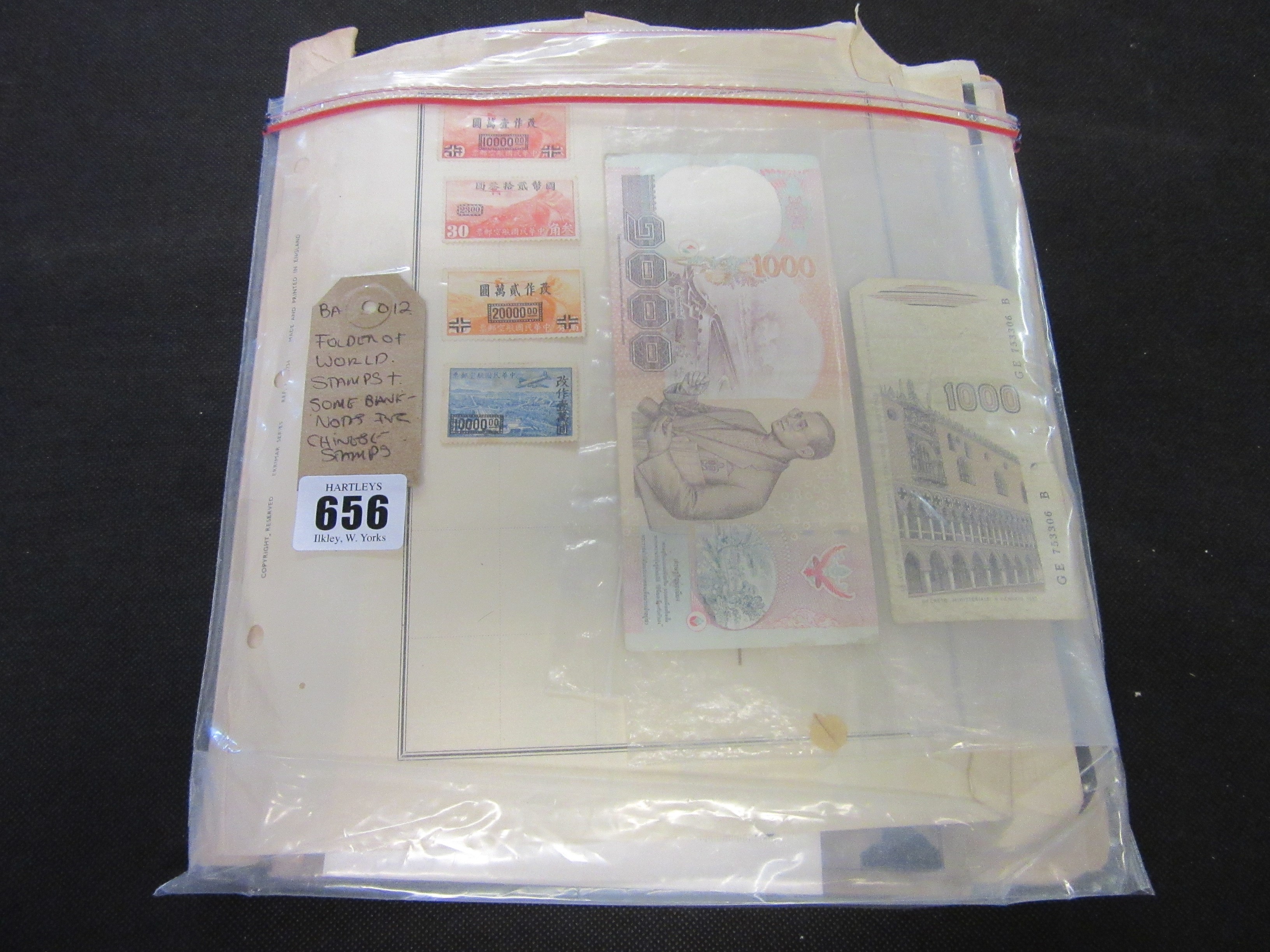 FOLDER OF WORLD STAMPS INCLUDING CHINESE EXAMPLES WITH WORLD BANK NOTES Image