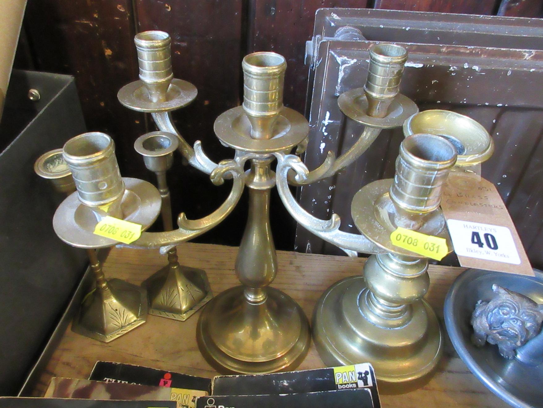 FOUR BRASS CANDLESTICKS Image