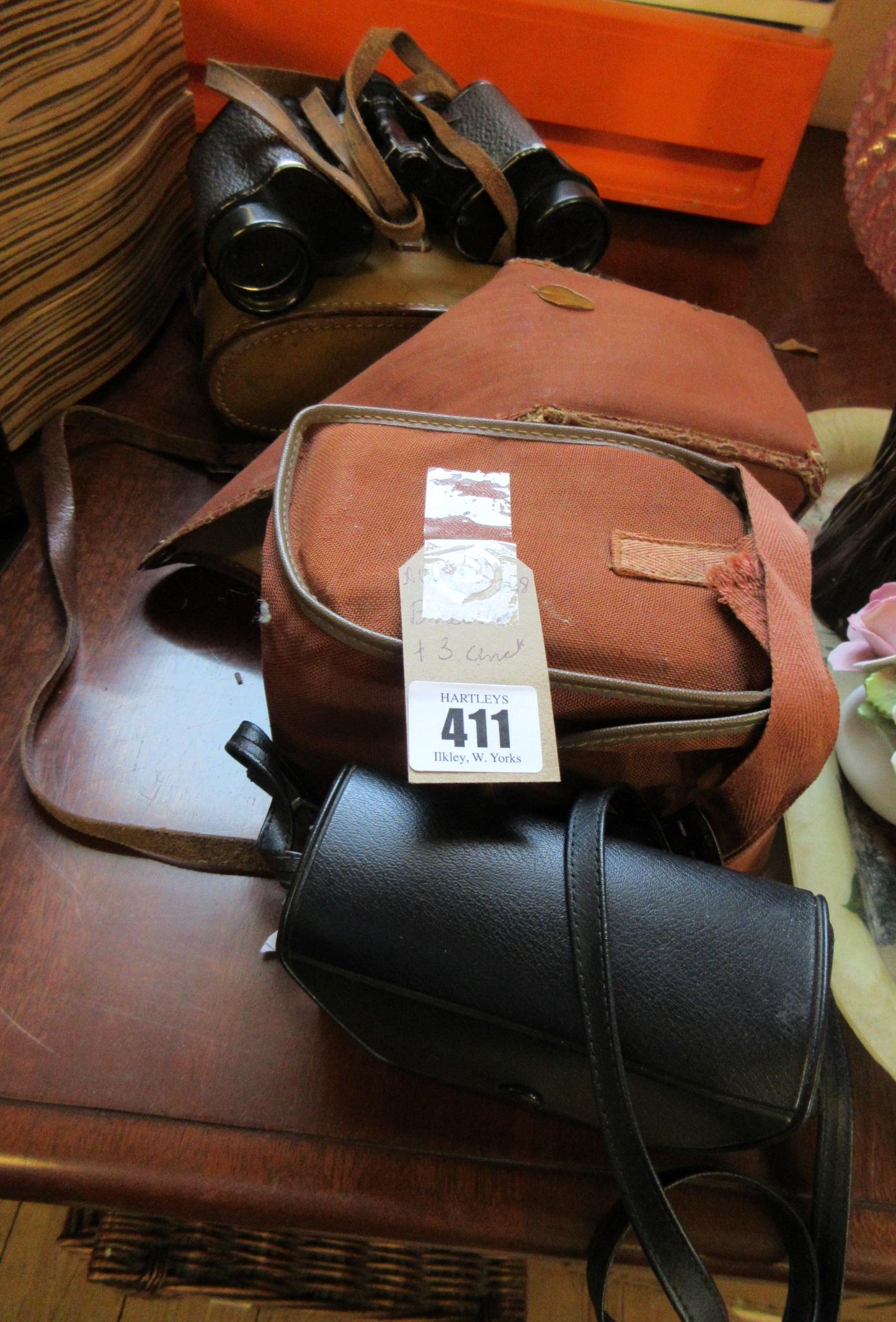 BINOCULARS AND THREE CAMERAS Image