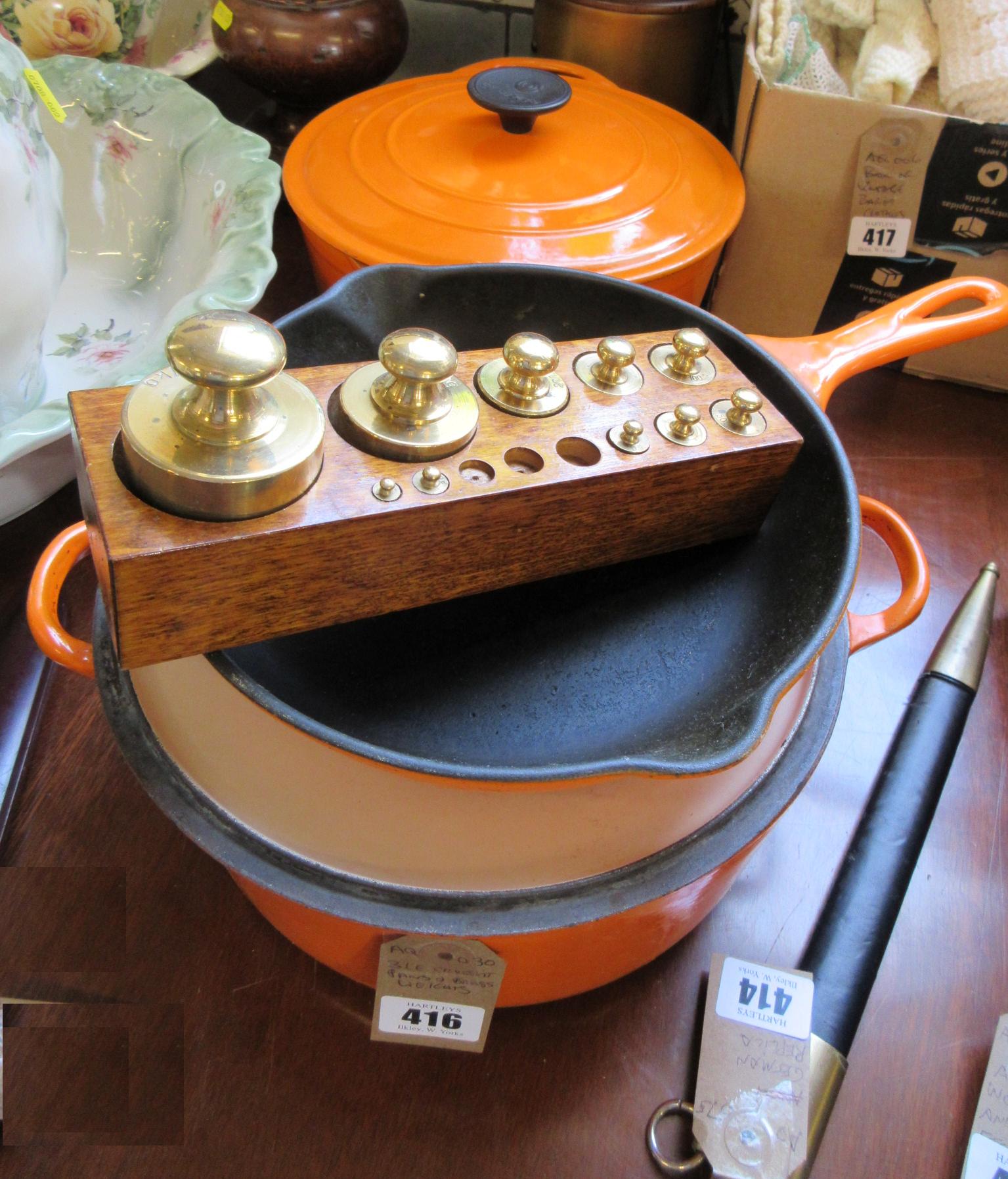THREE LE CREUSET PANS AND BRASS WEIGHTS Image