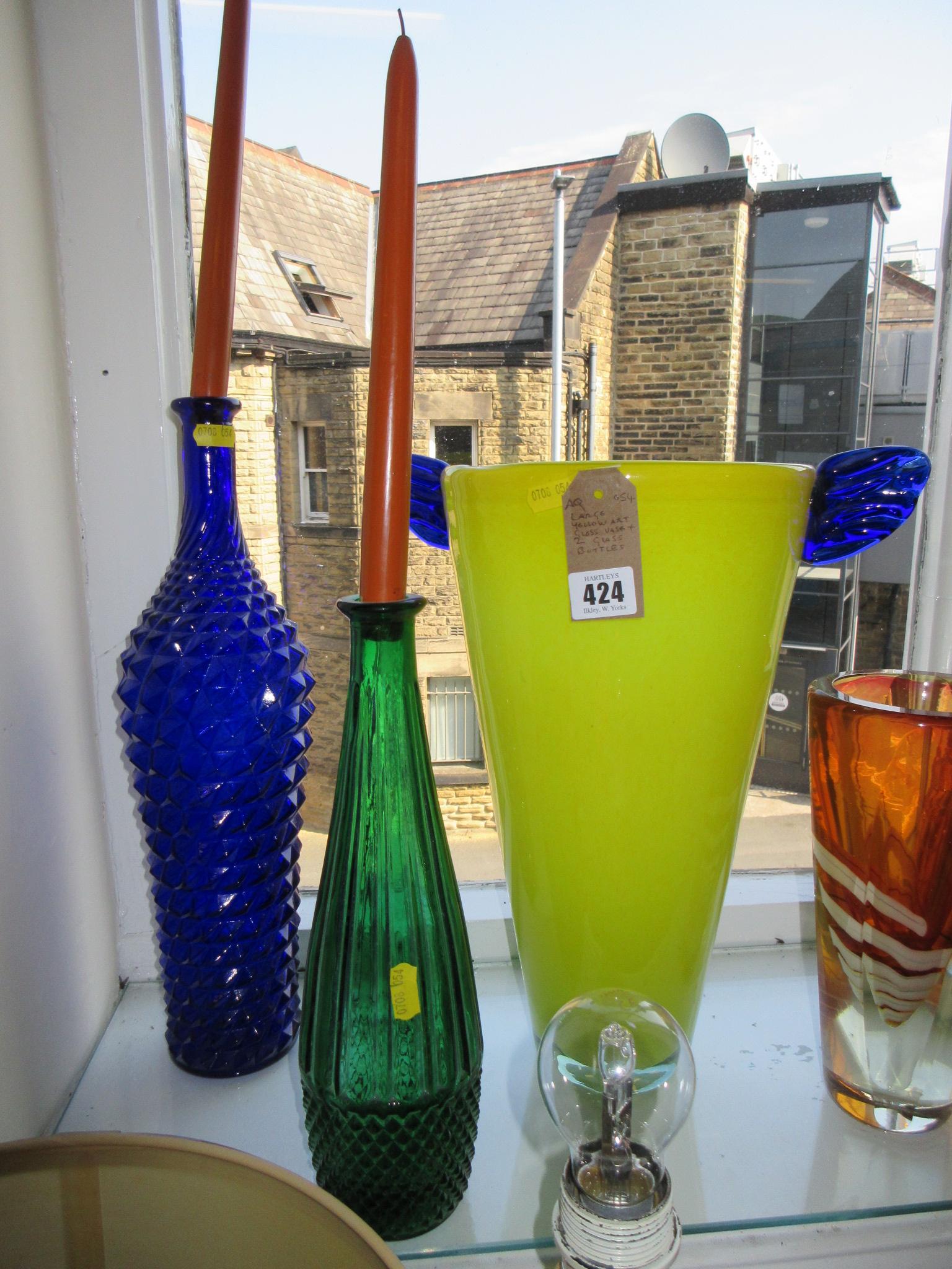 LARGE YELLOW GLASS VASE AND TWO GLASS BOTTLES Image