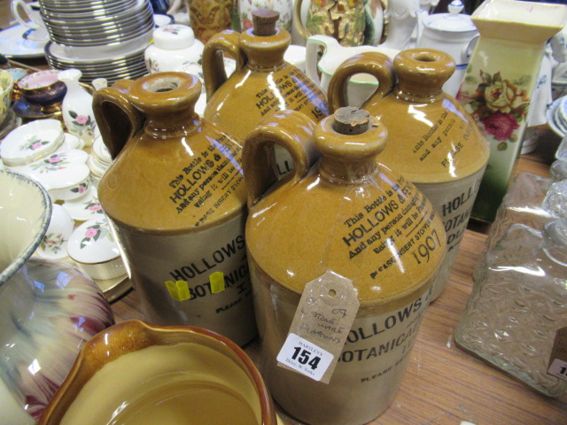 FOUR STONEWARE FLAGONS Image