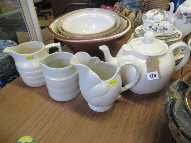 LARGE ENGLISH STONEWARE TEAPOT AND THREE STONEWARE JUGS Image