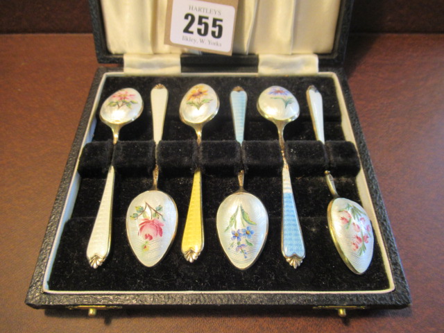 CASED SET OF SIX SILVER AND ENAMEL TEASPOONS Image
