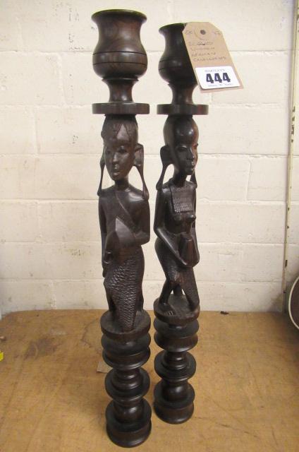 TWO CARVED AFRICAN CANDLESTICKS Image