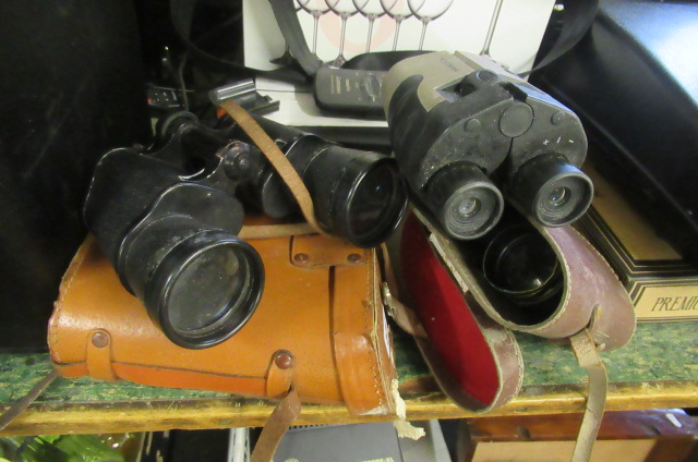 THREE PAIRS OF BINOCULARS Image