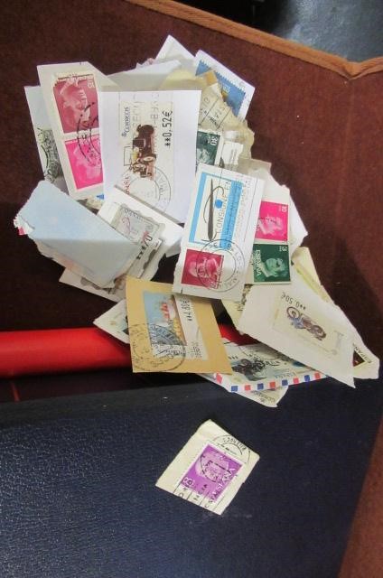 ENVELOPE OF STAMPS AND EMPTY ALBUM Image