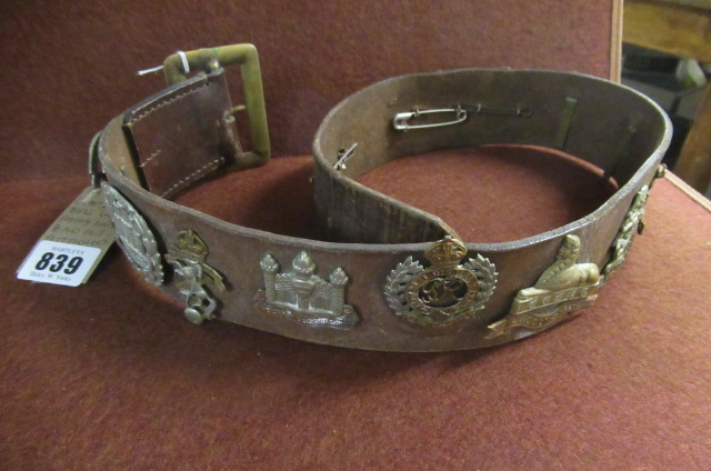 LEATHER BET WITH ARMY CAP BADGES ATTACHED Image