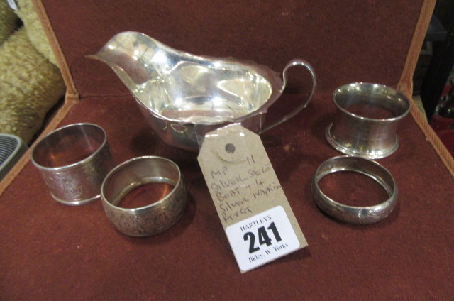 SILVER SAUCE BOAT AND FOUR SILVER NAPKIN RINGS Image