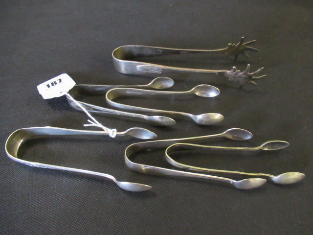 PAIR OF VICTORIAN SILVER SUGAR TONGS AND FIVE EPNS TONGS Image