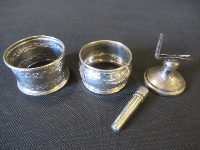 TWO SILVER NAPKIN RINGS ETC Image