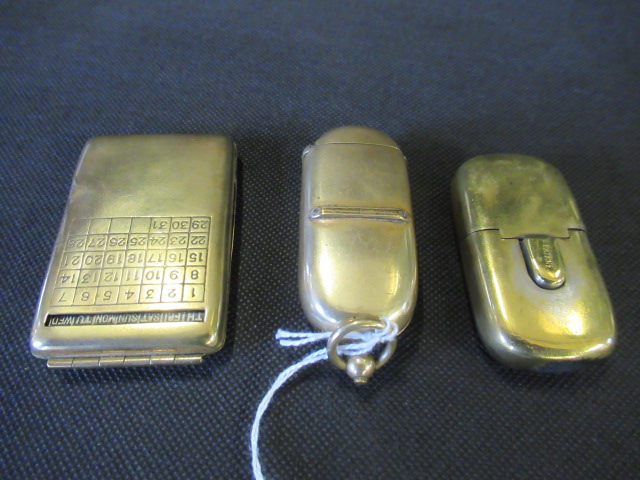BRASS CALENDAR MATCHBOOK CASE AND TWO PATENT ACTION VESTA CASES Image