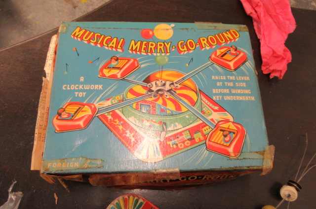 TIN PLATE MUSICAL MERRY GO ROUND TOY Image