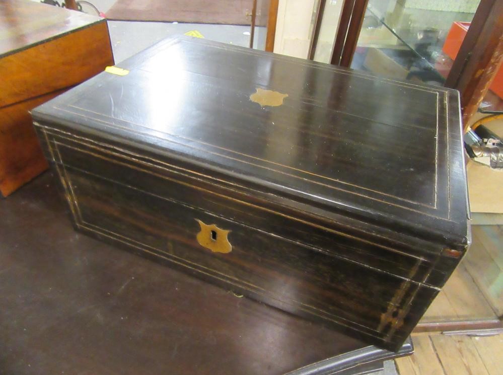 WALNUT BRASS BANDED WRITING SLOPE AND AN EBONY WRITING SLOPE Image