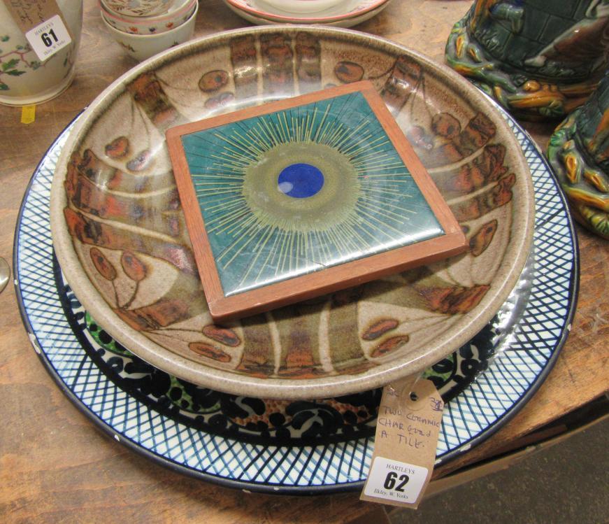 TWO CERAMIC CHARGERS AND A TILE Image