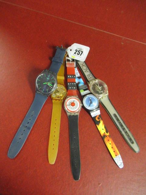 FIVE SWATCH WATCHES INCLUDING NEON BLUE REBEL AND FIND THE CODE Image