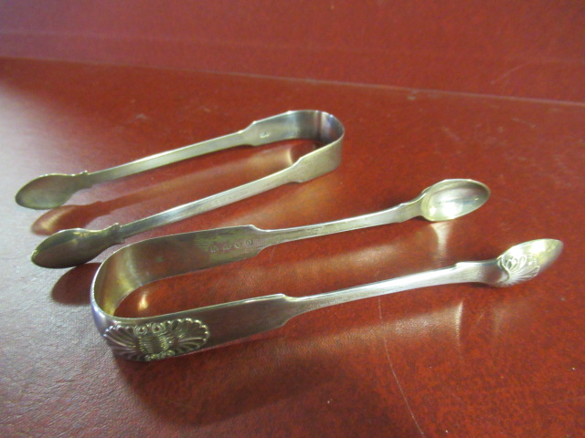 TWO PAIRS OF GEORGIAN SILVER SUGAR TONGS Image