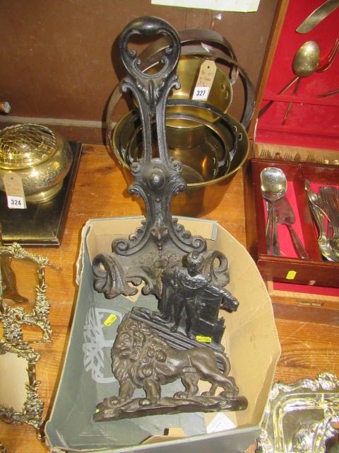 THREE CAST IRON DOORSTOPS Image