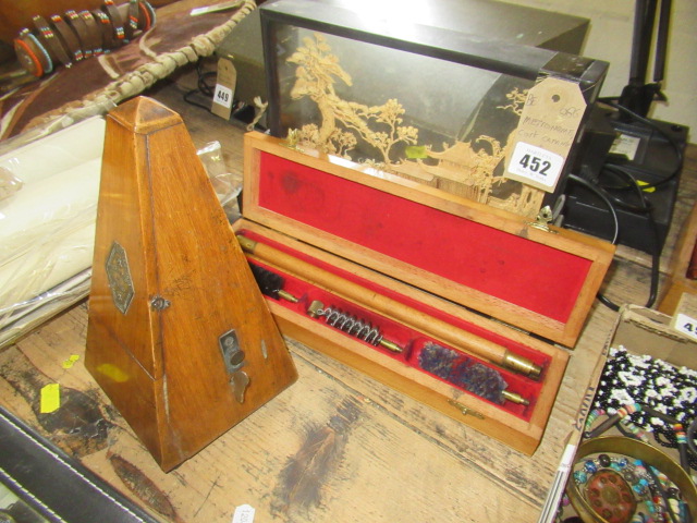 METRONOME, CORK DIORAMA AND GUN CLEANING KIT Image