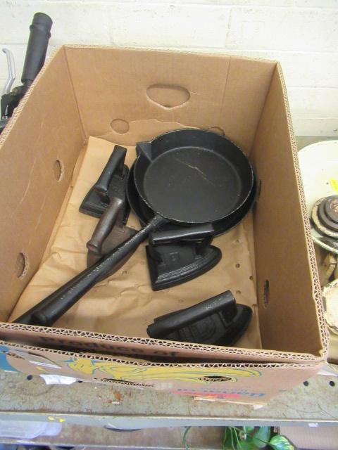 TWO CAST IRON PANS AND FOUR FLAT IRONS Image