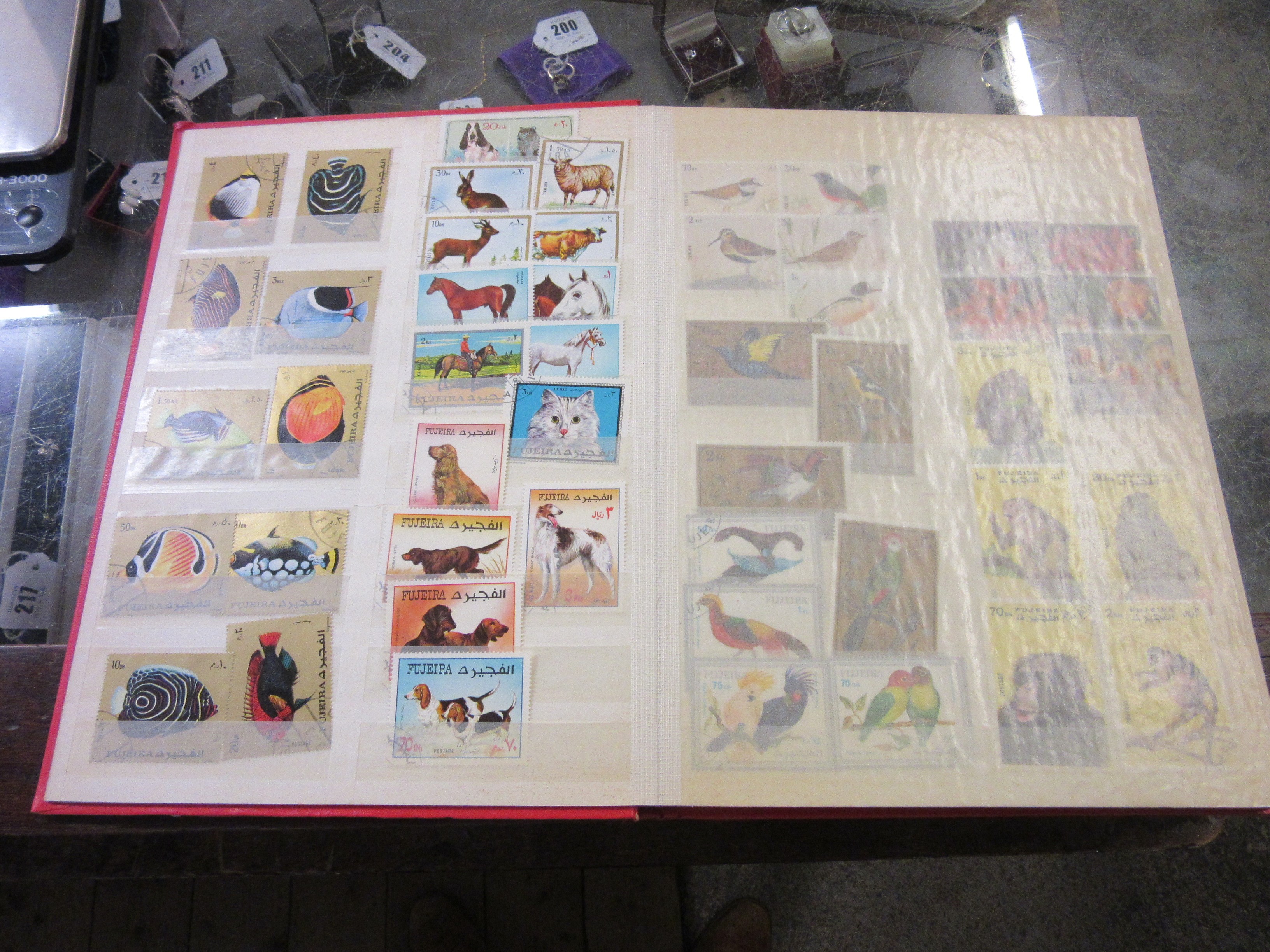 TWO ALBUMS OF AJMAN AND FUJEIRA STAMPS Image