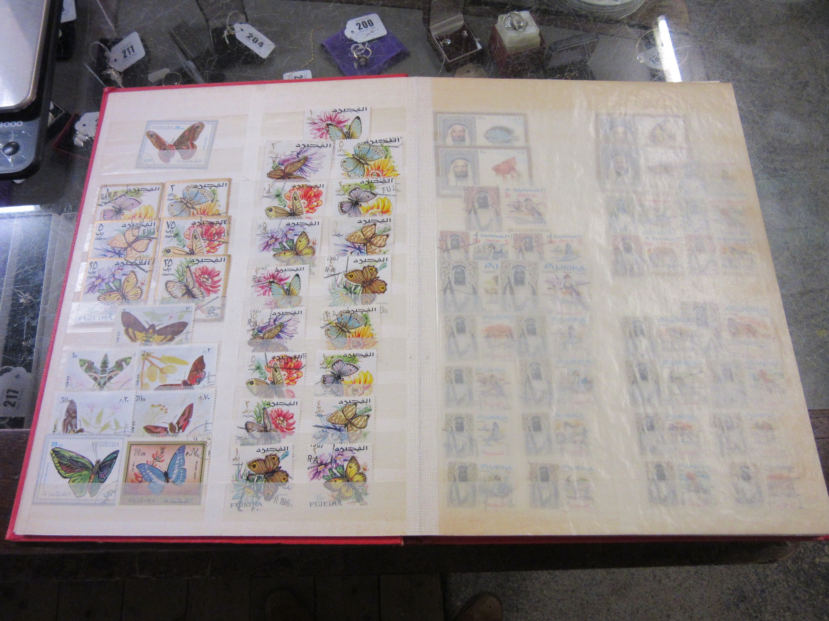 TWO ALBUMS OF AJMAN AND FUJEIRA STAMPS Image