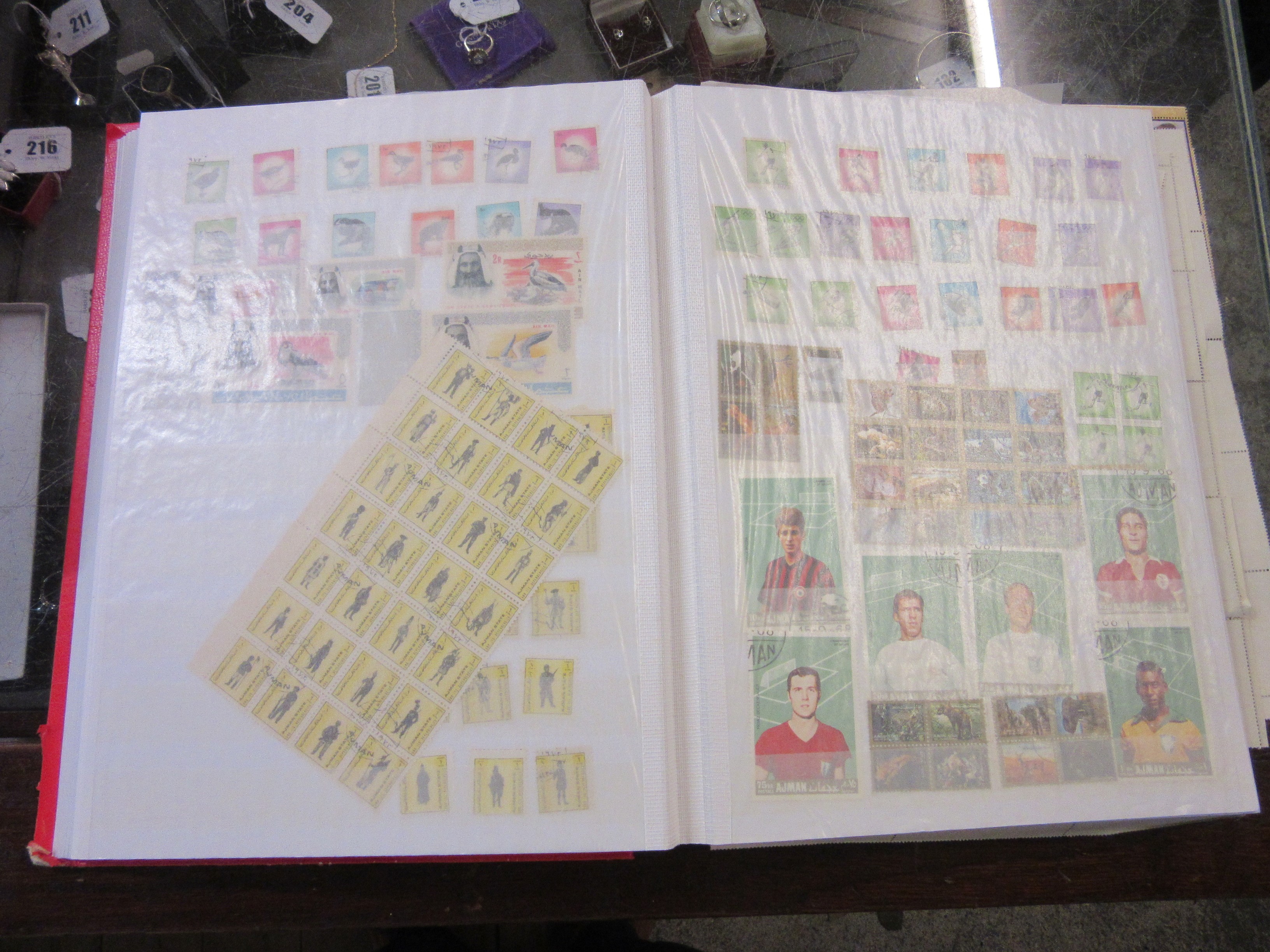 TWO ALBUMS OF AJMAN AND FUJEIRA STAMPS Image