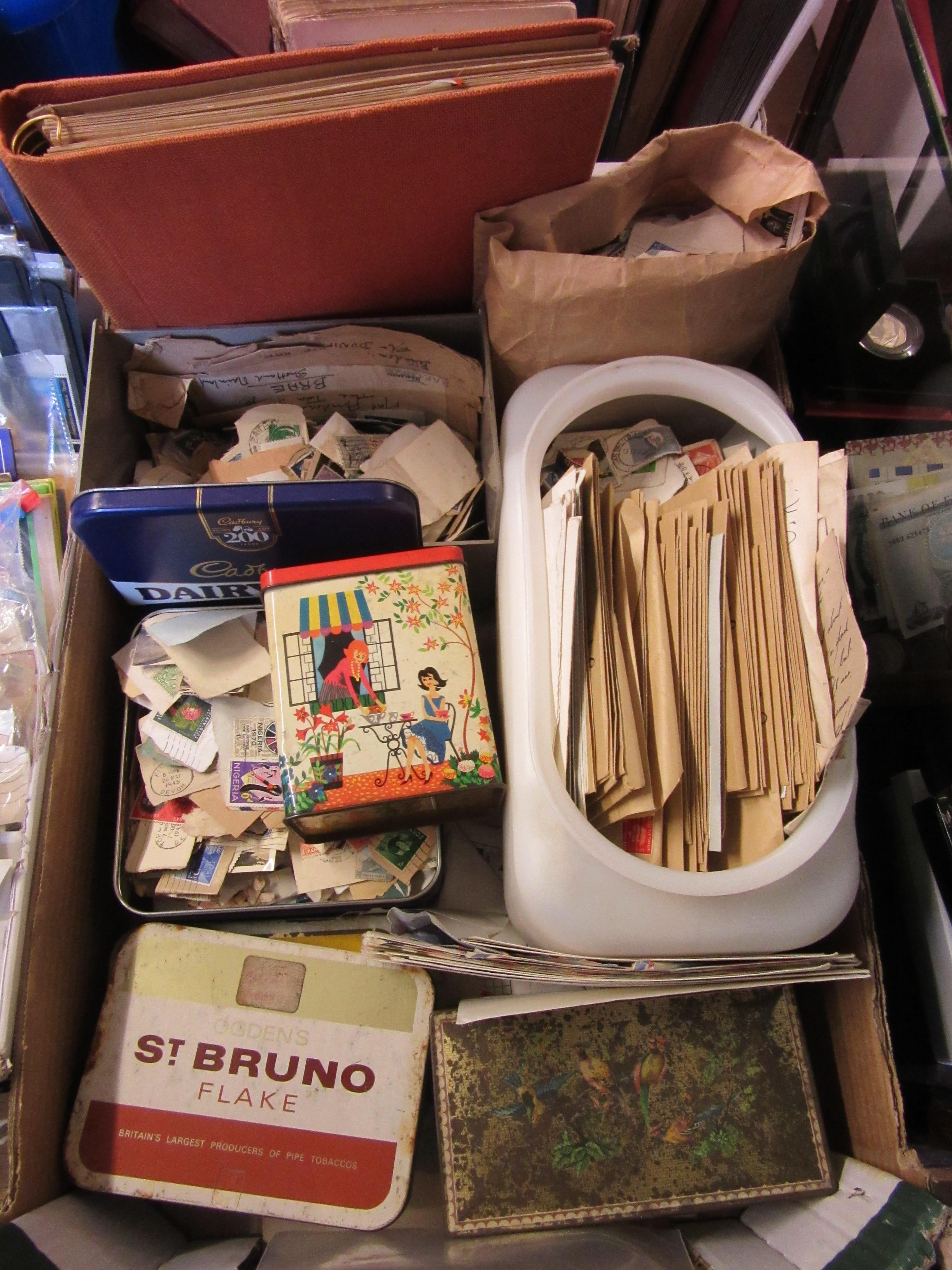 VINTAGE TINS OF LOOSE STAMPS AND FIRST DAY COVERS WITH BAG OF TRANSPORTATION TICKETS Image