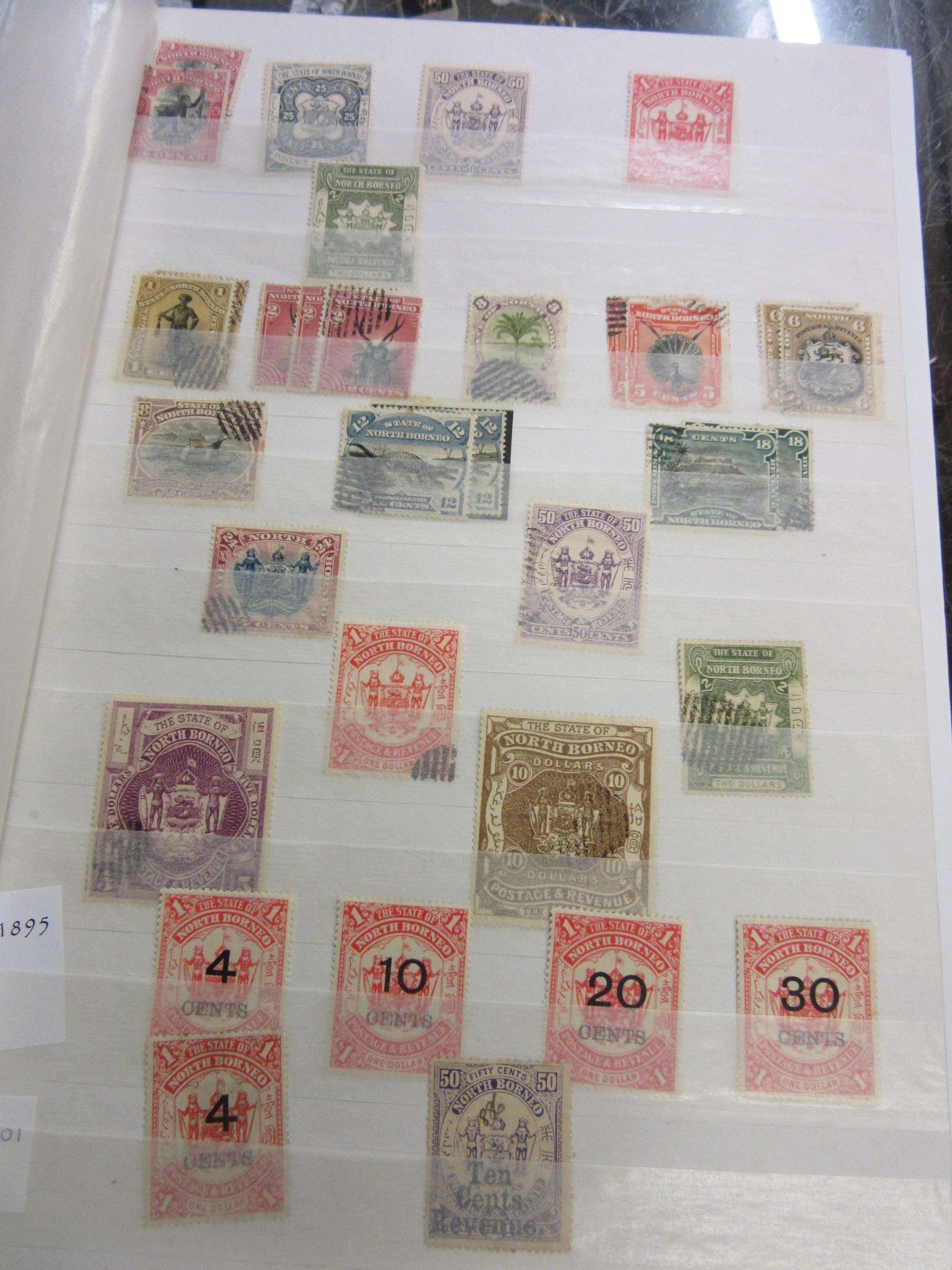 THREE ALBUMS OF MALAYSIAN, NORTH BORNEO, CAMBODIAN AND LAOS STAMPS Image