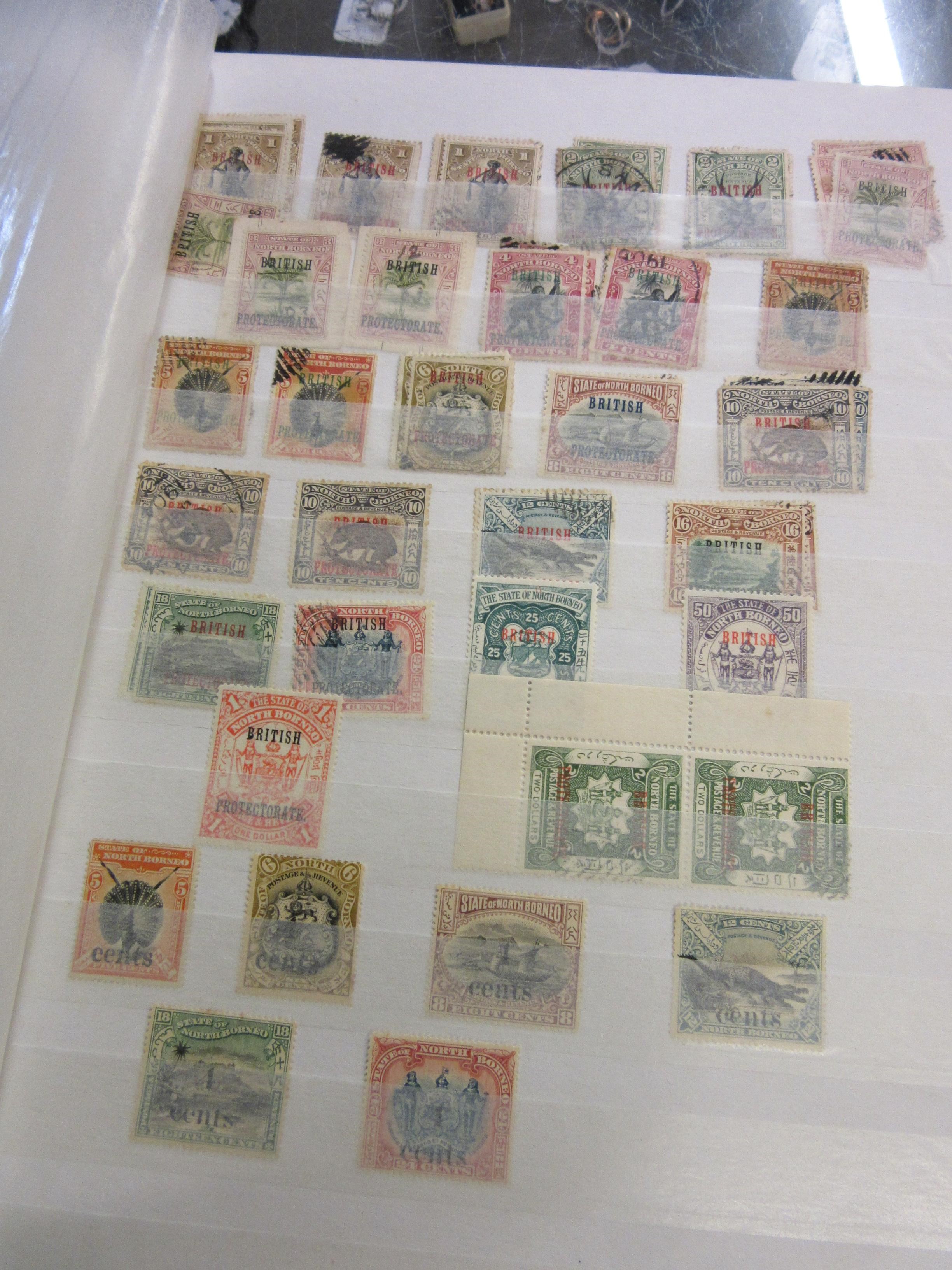 THREE ALBUMS OF MALAYSIAN, NORTH BORNEO, CAMBODIAN AND LAOS STAMPS Image