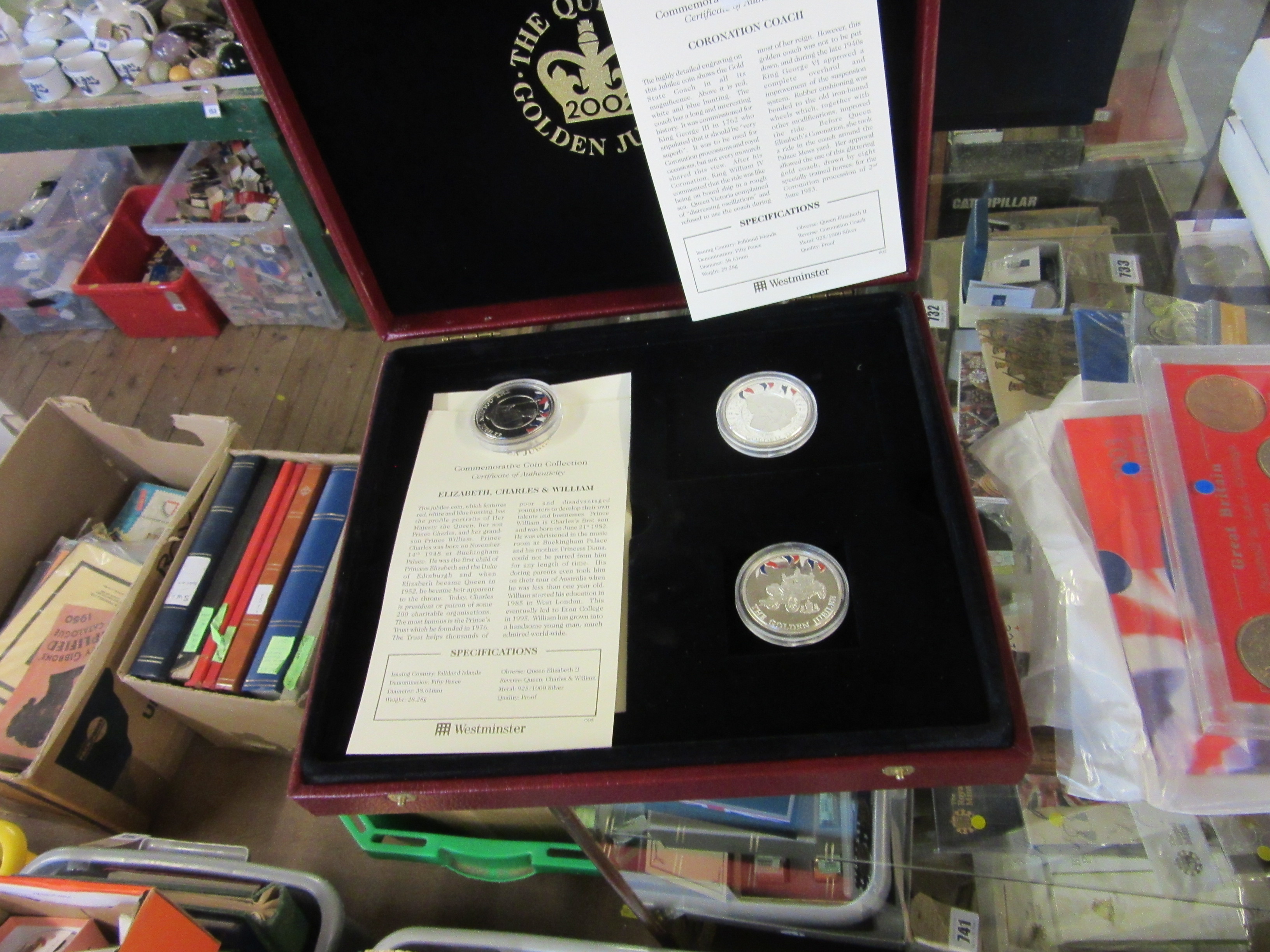 SILVER CORONATION COACH , ERII , CHARLES AND WILLIAM 2002 COINS AND ONE OTHER IN A WOODEN CASE (3) Image