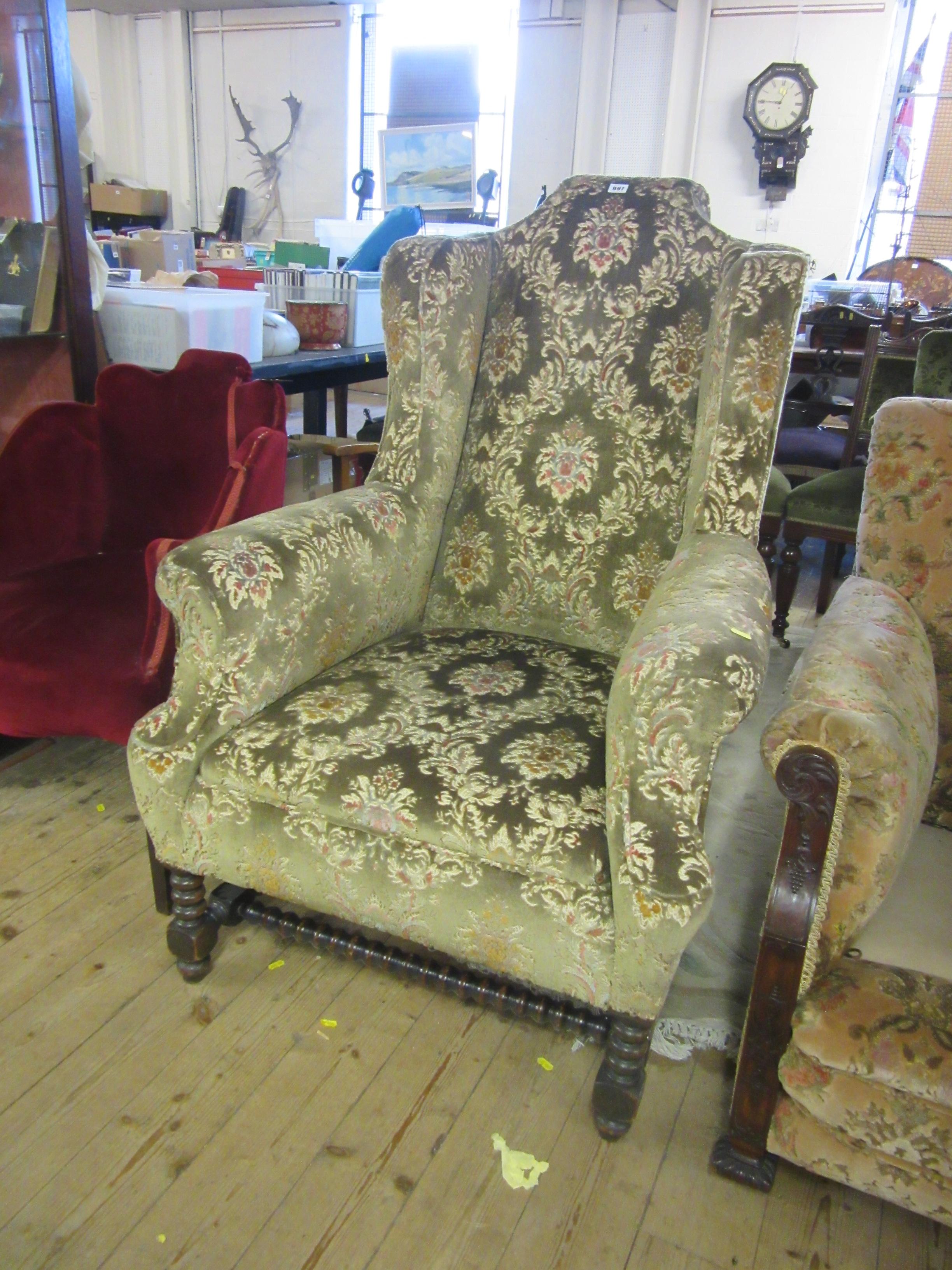HIGH BACKED UPHOLSTERED ARMCHAIR Image