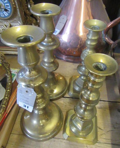 TWO PAIRS OF BRASS CANDLESTICKS Image